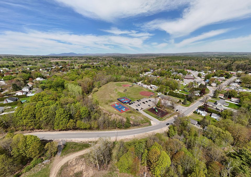 Aerial view of the Morrisonville recreation fields, colorful courts and playground, May 2026